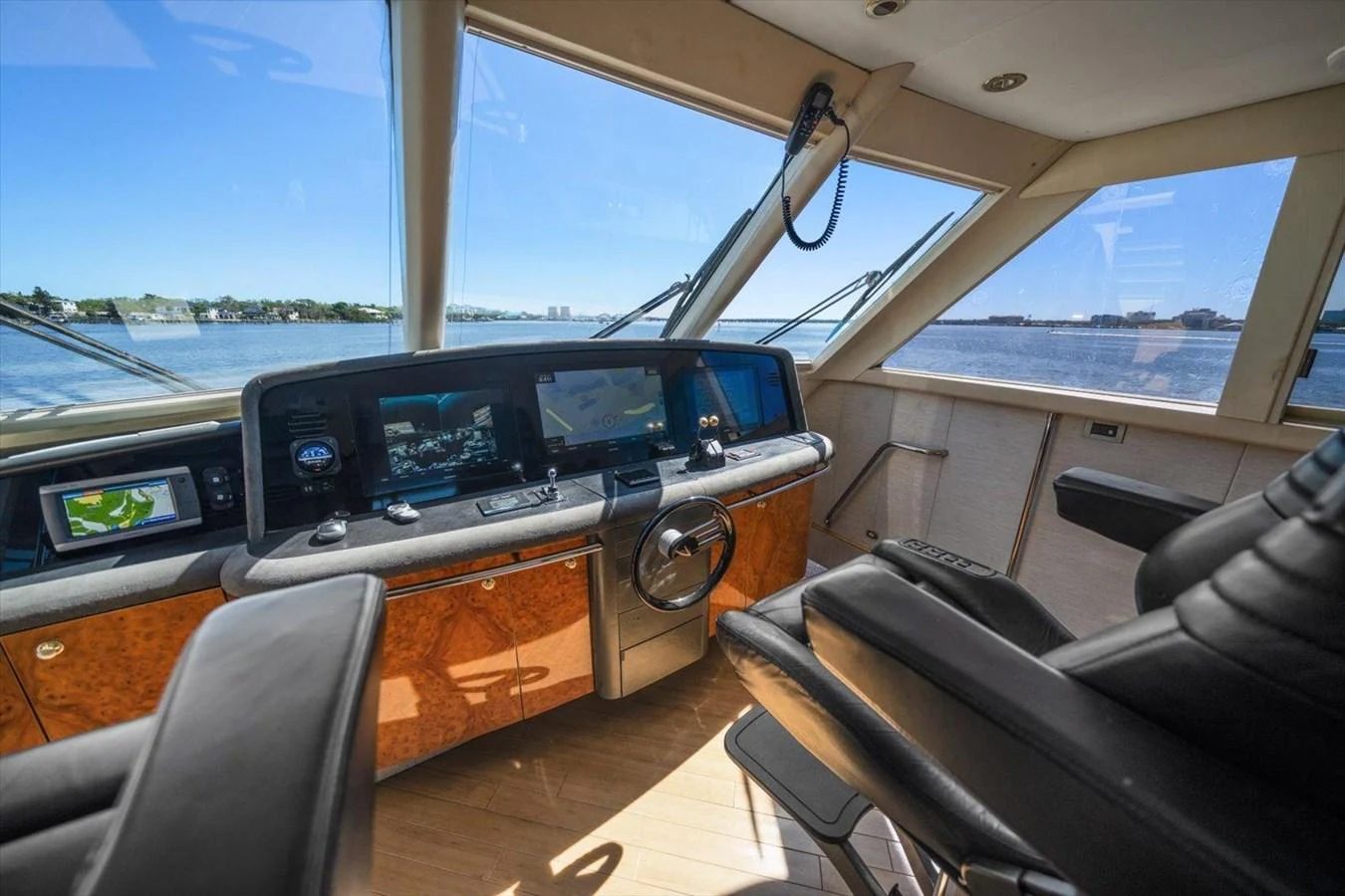 The helm station offers a commanding view with advanced navigation equipment and luxurious seating. aboard OCTOPI Yacht for Sale