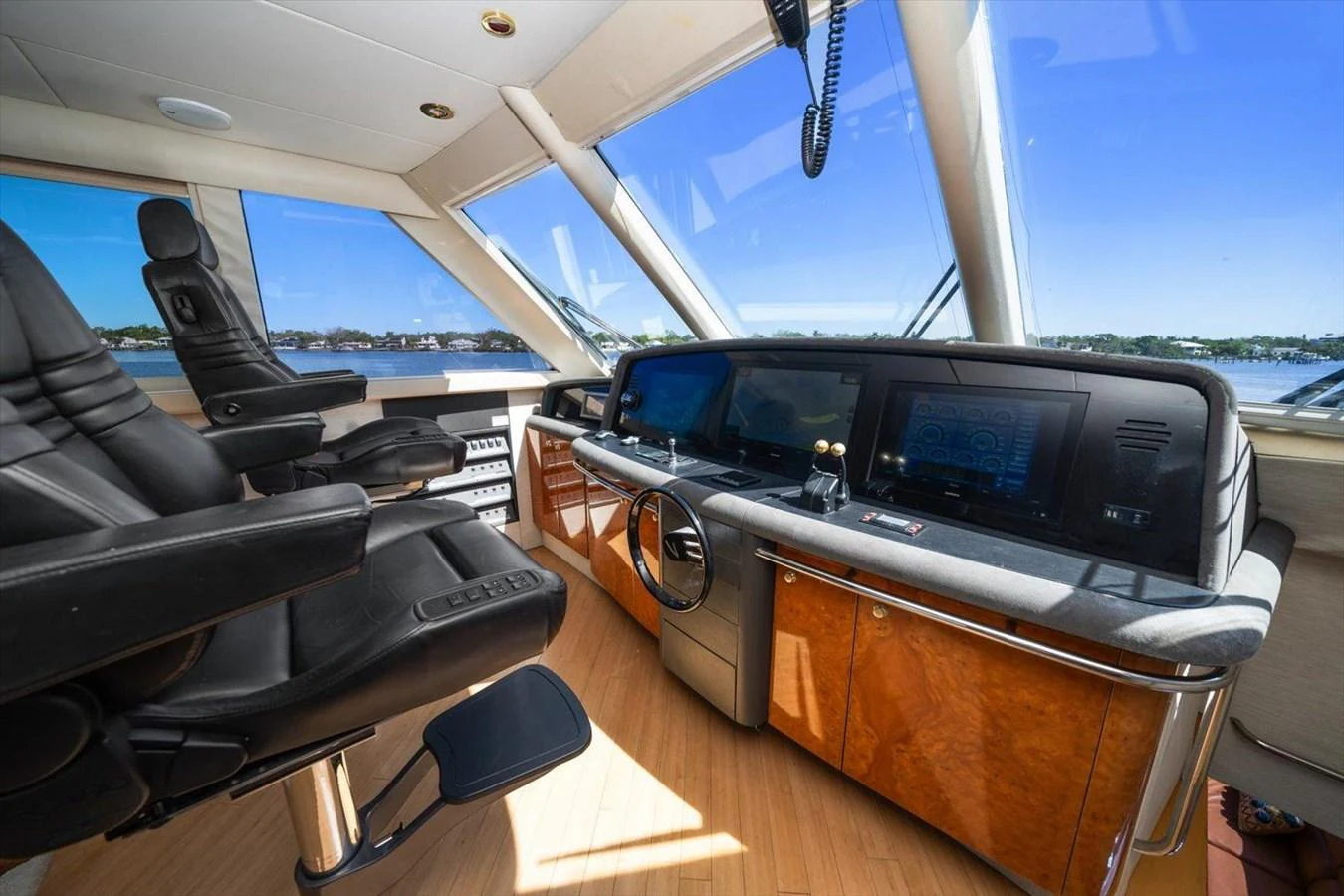 The helm station offers a commanding view with state-of-the-art navigation equipment and luxurious seating. aboard OCTOPI Yacht for Sale