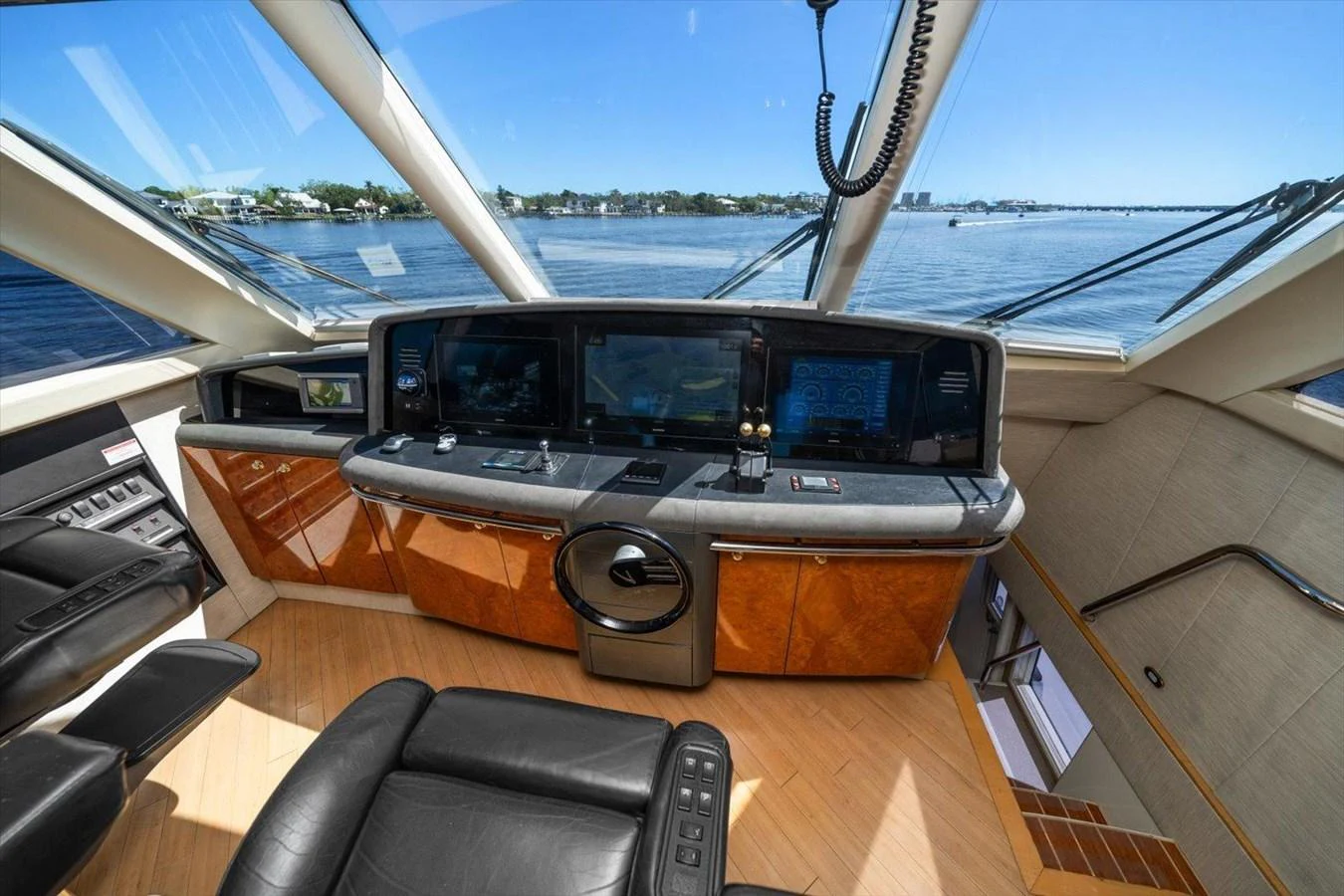 The helm station features state-of-the-art navigation equipment with panoramic views. aboard OCTOPI Yacht for Sale