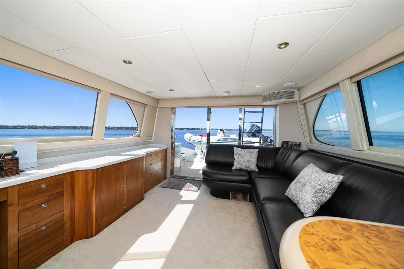 The salon offers a spacious and comfortable seating area with panoramic views of the water. aboard OCTOPI Yacht for Sale