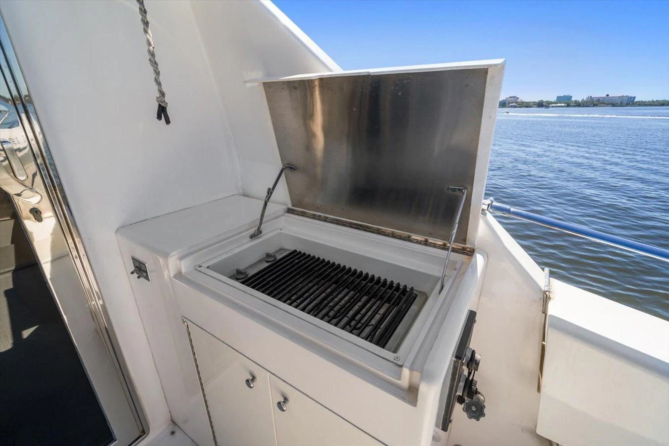 This image showcases a built-in grill on the yacht, perfect for outdoor cooking with a view of the water. aboard OCTOPI Yacht for Sale