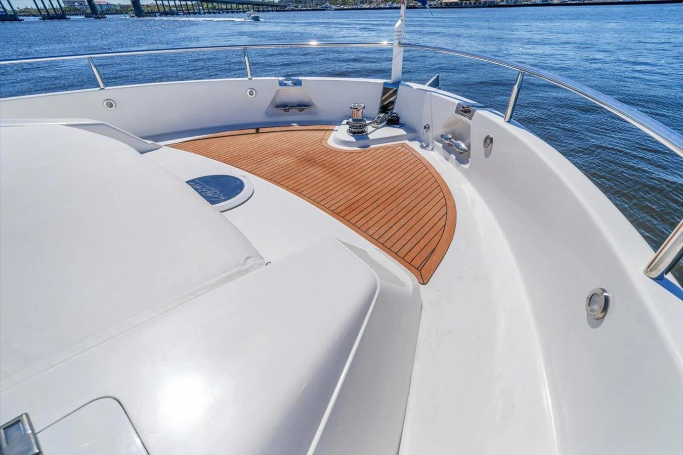 The foredeck of the yacht features a sleek design with a teak inlay and stainless steel fittings. aboard OCTOPI Yacht for Sale