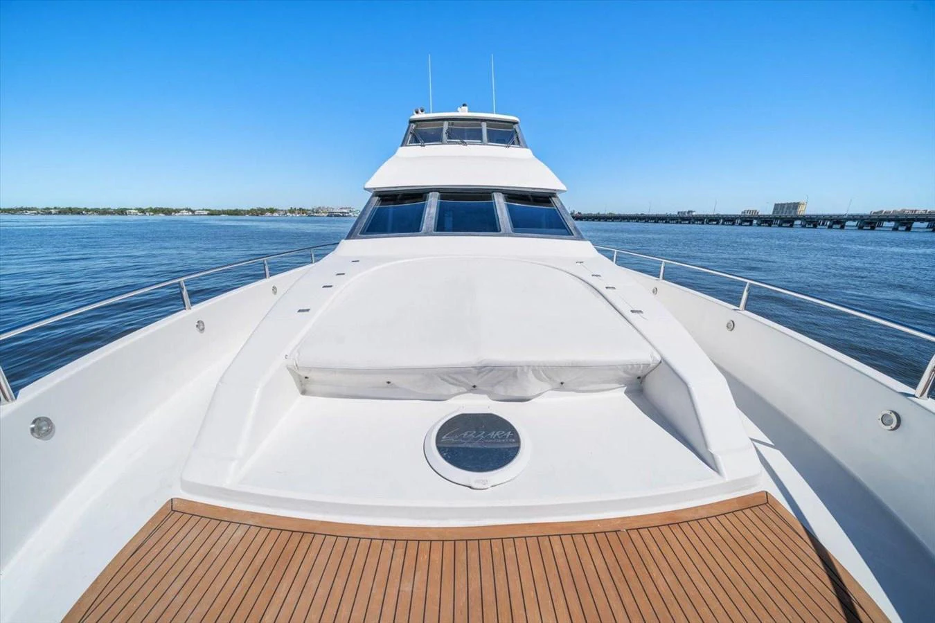 The yacht's sleek exterior is showcased against a serene water backdrop. aboard OCTOPI Yacht for Sale
