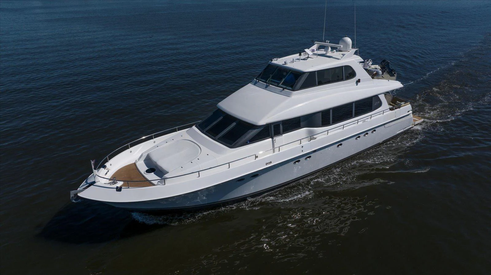 A sleek and modern yacht cruises smoothly on calm waters. aboard OCTOPI Yacht for Sale