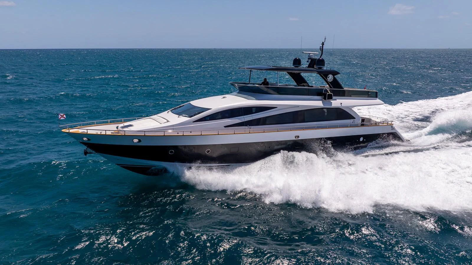 A sleek and modern yacht cruises swiftly through the open sea, showcasing its elegant design and powerful performance. aboard SEA METRI V Yacht for Sale