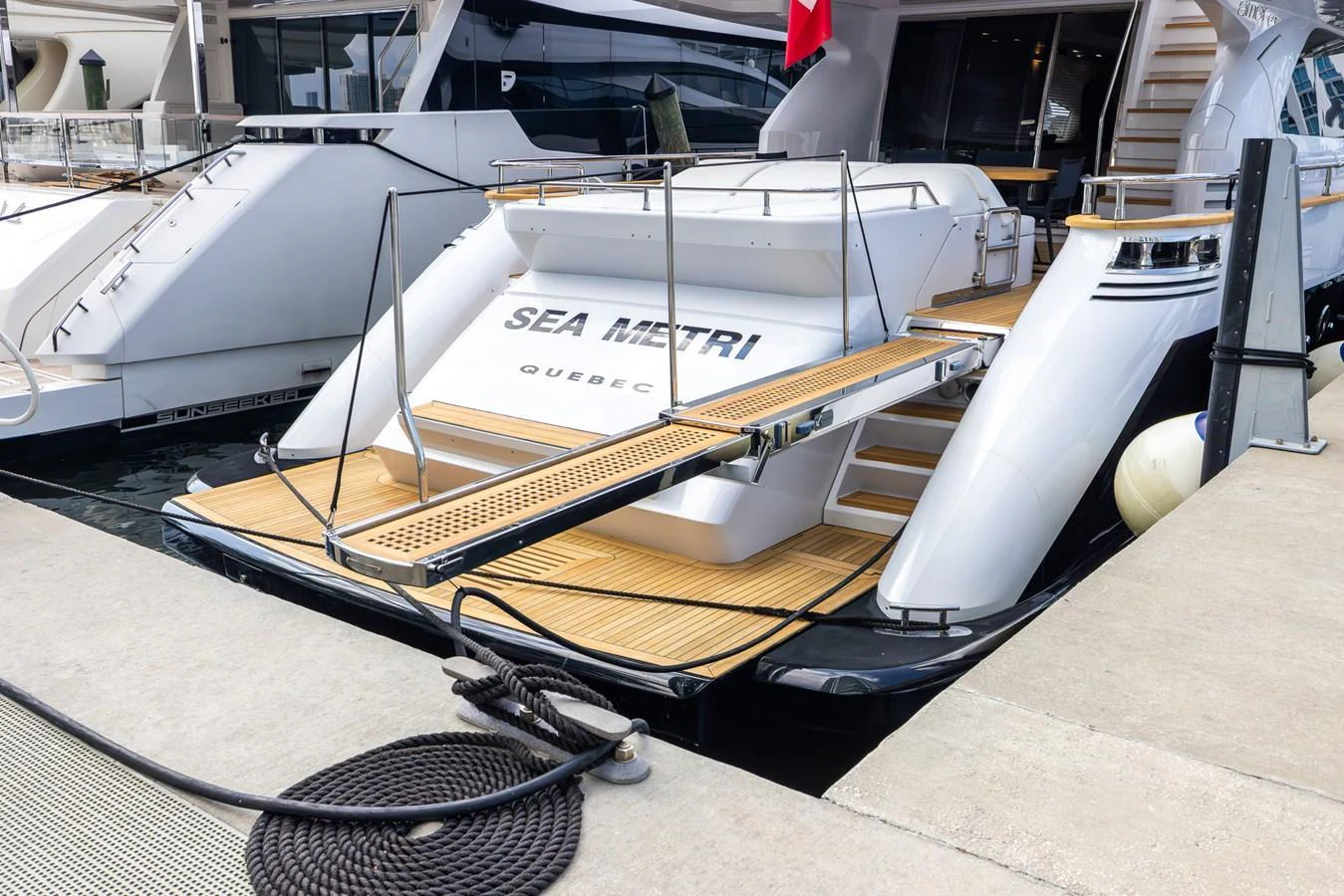 The stern of the yacht features a spacious swim platform with a boarding ramp and elegant teak decking. aboard SEA METRI V Yacht for Sale