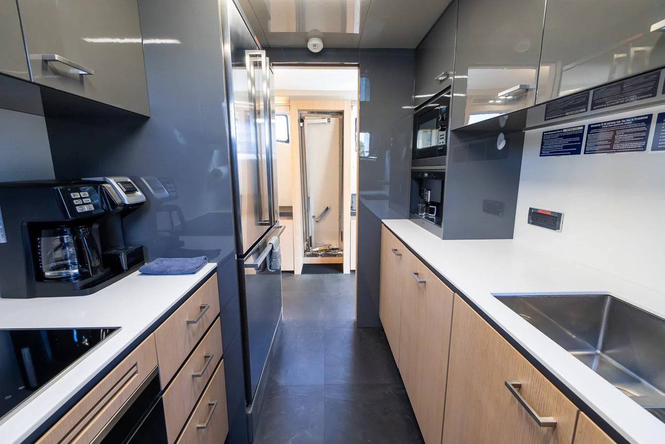 The galley features modern appliances and a sleek design, perfect for gourmet cooking at sea. aboard SEA METRI V Yacht for Sale