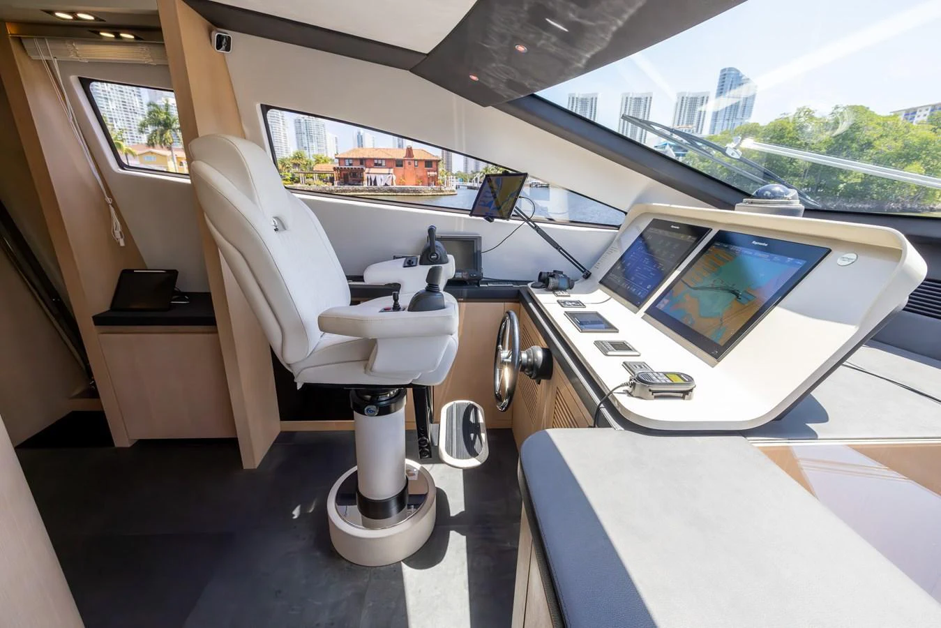 The helm station features advanced navigation equipment and a comfortable captain's chair. aboard SEA METRI V Yacht for Sale