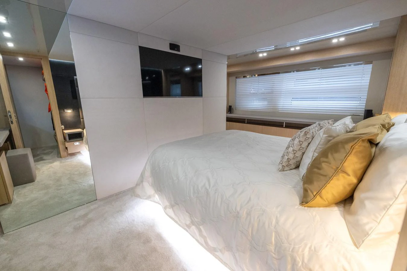 The master stateroom features a luxurious bed with plush pillows and modern decor. aboard SEA METRI V Yacht for Sale