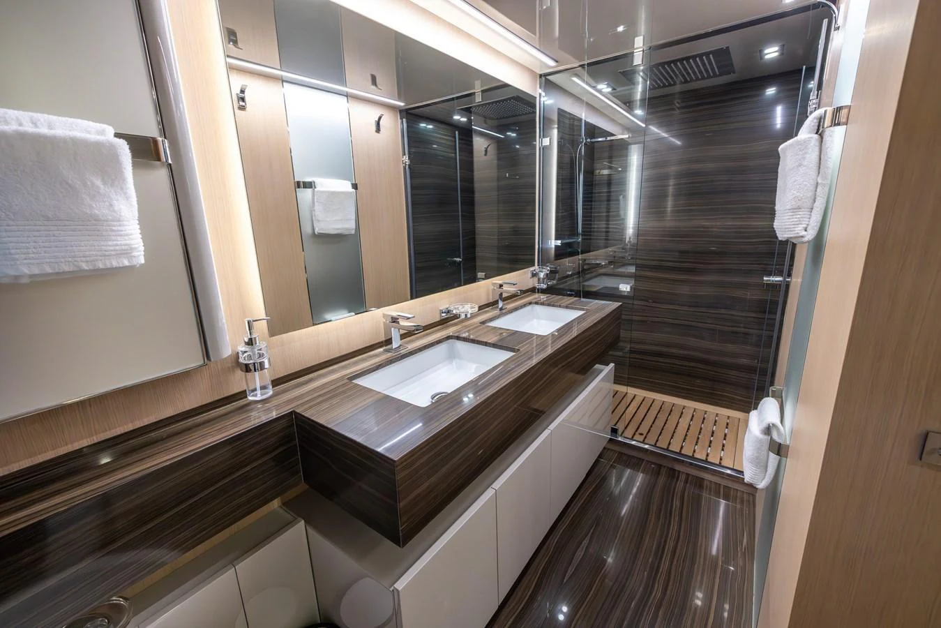 The yacht's bathroom features a sleek design with modern fixtures and ample lighting. aboard SEA METRI V Yacht for Sale
