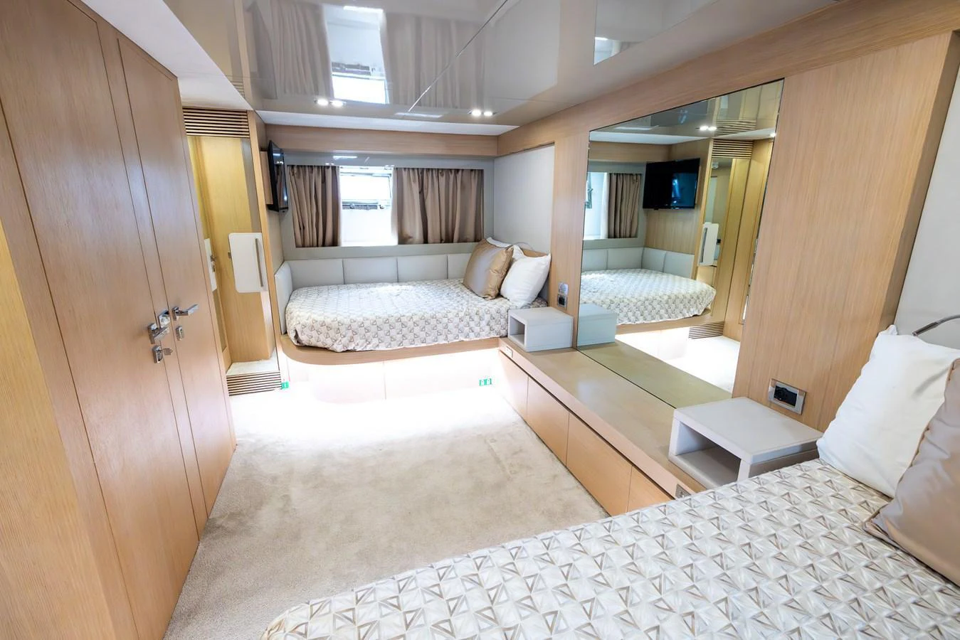 The guest stateroom features a modern design with ample natural light and luxurious bedding. aboard SEA METRI V Yacht for Sale