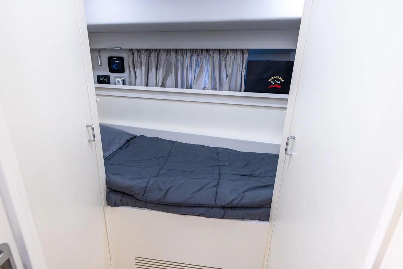 A compact crew cabin with a single bed and essential amenities. aboard SEA METRI V Yacht for Sale