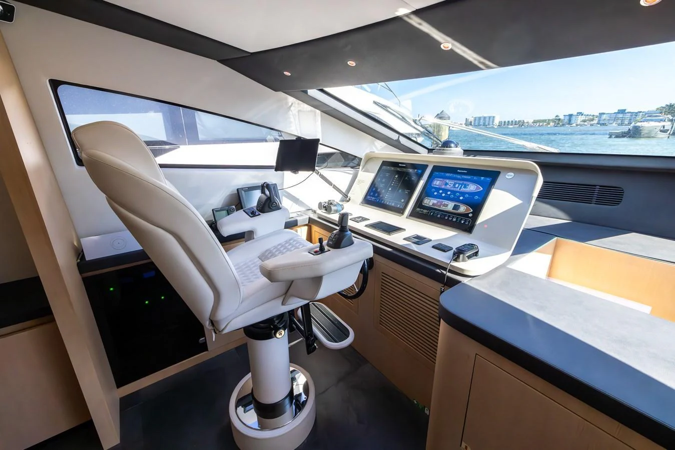 The helm station offers a modern and sleek design with advanced navigation equipment and a comfortable captain's chair. aboard SEA METRI V Yacht for Sale