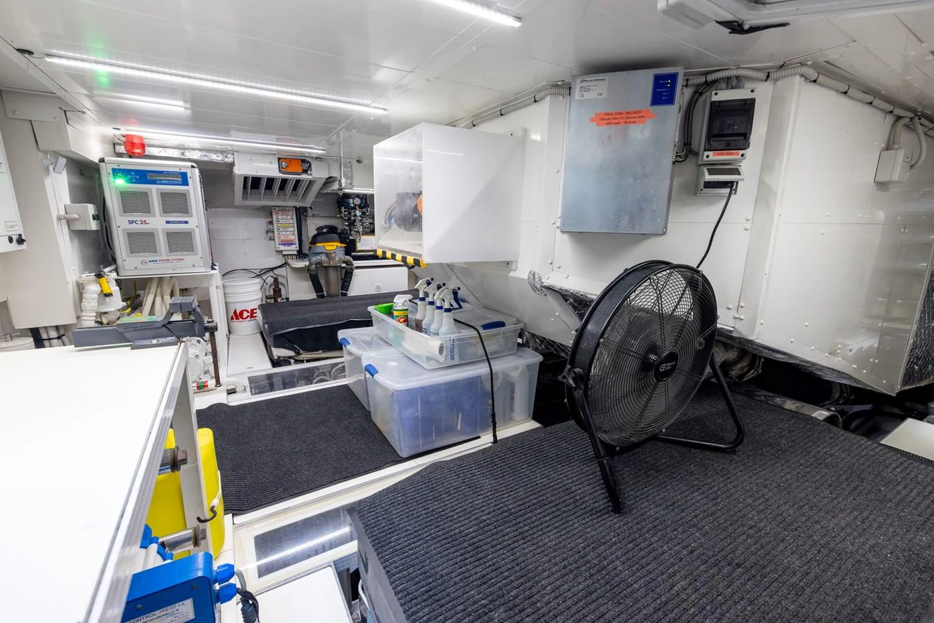 The engine room is well-organized and equipped with essential machinery and tools. aboard SEA METRI V Yacht for Sale