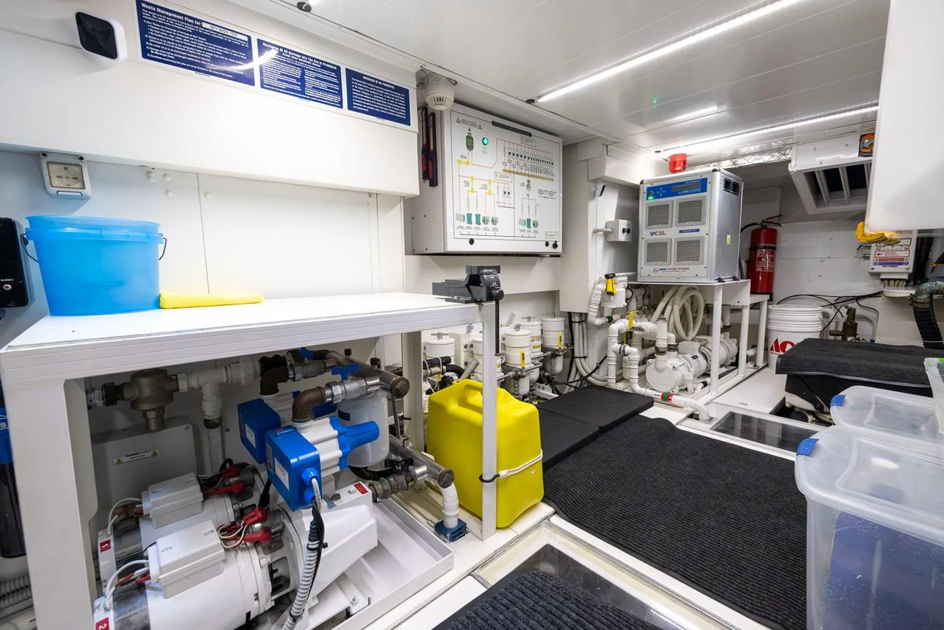 The image showcases a well-organized and clean engine room with advanced equipment and systems. aboard SEA METRI V Yacht for Sale
