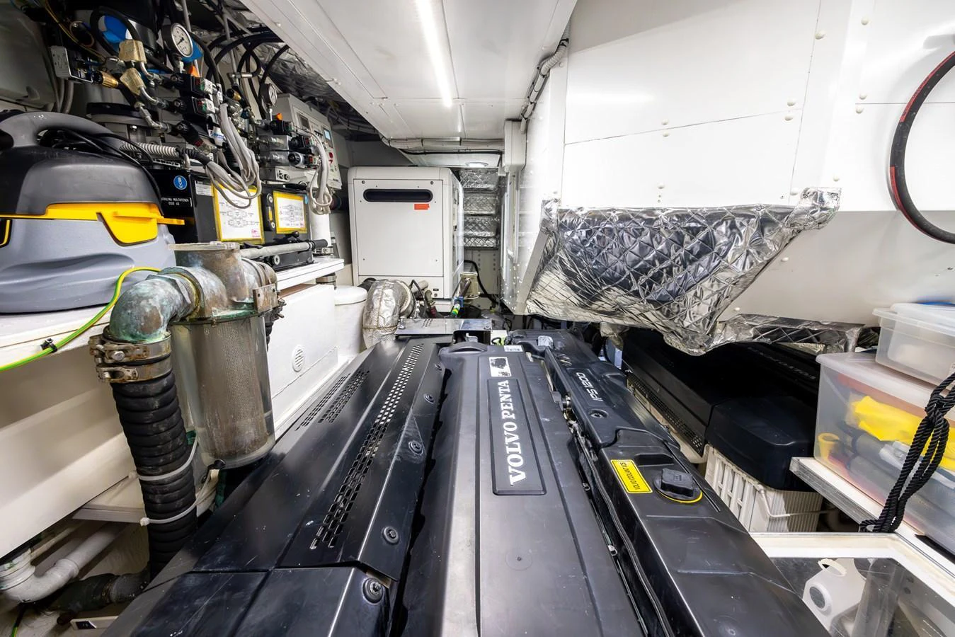 The image showcases the well-organized engine room of the yacht, featuring a Volvo Penta engine. aboard SEA METRI V Yacht for Sale