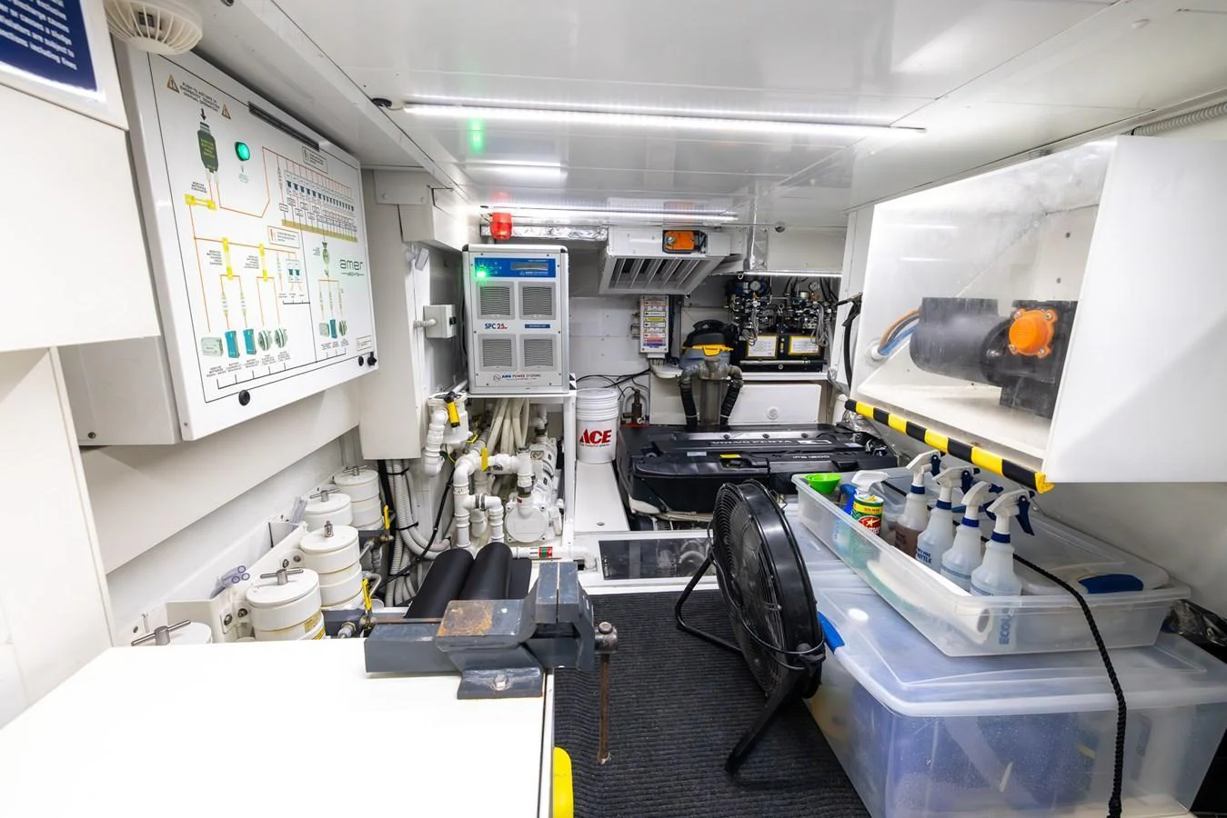 The image showcases a well-organized engine room with various equipment and tools neatly arranged. aboard SEA METRI V Yacht for Sale