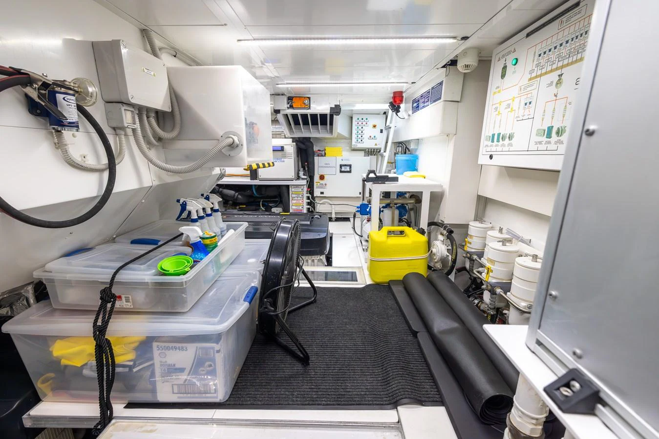 The engine room is well-organized with various equipment and storage solutions. aboard SEA METRI V Yacht for Sale