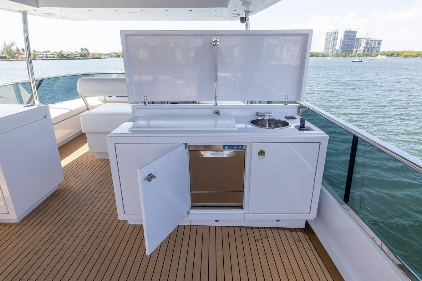 The yacht features a sleek outdoor galley with modern appliances and ample counter space, perfect for alfresco dining. aboard SEA METRI V Yacht for Sale