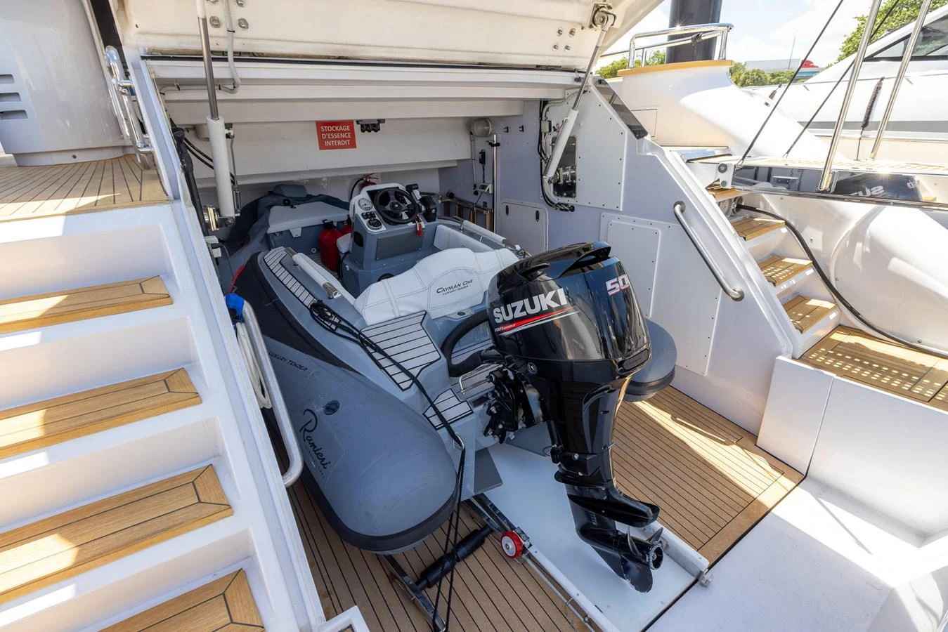 A sleek tender with a powerful Suzuki outboard motor is stored in the yacht's garage. aboard SEA METRI V Yacht for Sale