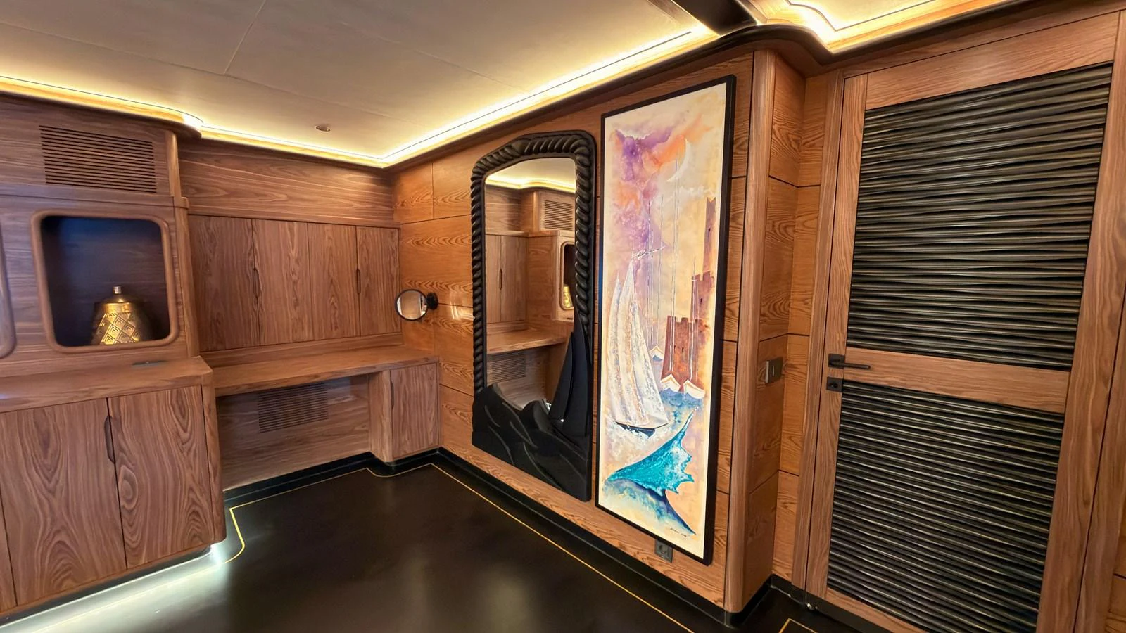 The yacht's interior features elegant wooden paneling and a large decorative painting. aboard OGUZ KHAN Yacht for Sale