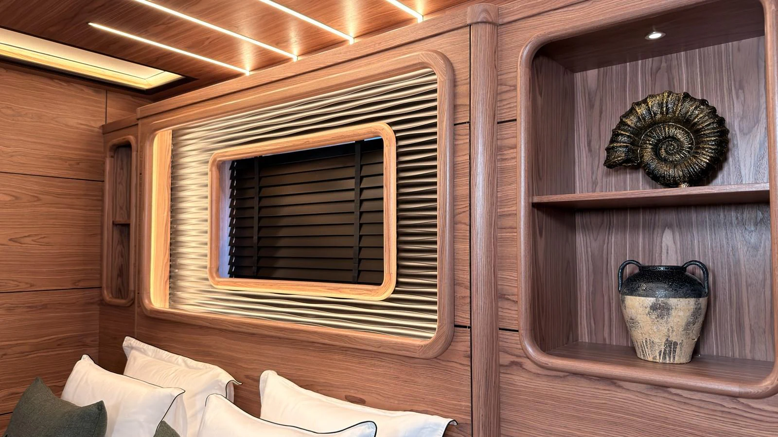 The yacht's interior features elegant wood paneling and tasteful decorative elements. aboard OGUZ KHAN Yacht for Sale