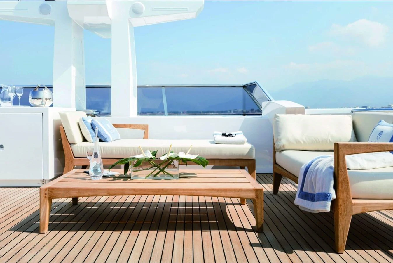a deck with a table and chairs aboard SHABBY OF THE SEAS Yacht for Sale