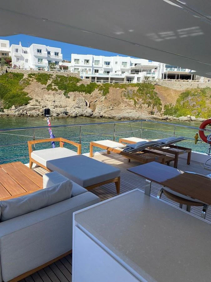 a pool with a building in the background aboard SHABBY OF THE SEAS Yacht for Sale