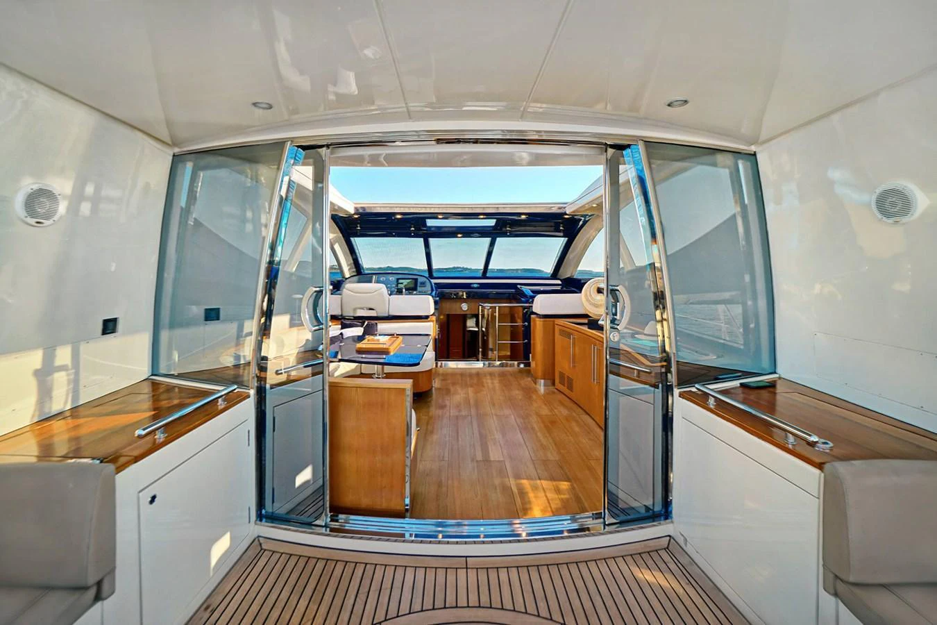 The salon features a spacious and inviting area with ample natural light and elegant furnishings. aboard RIVA 72' Yacht for Sale