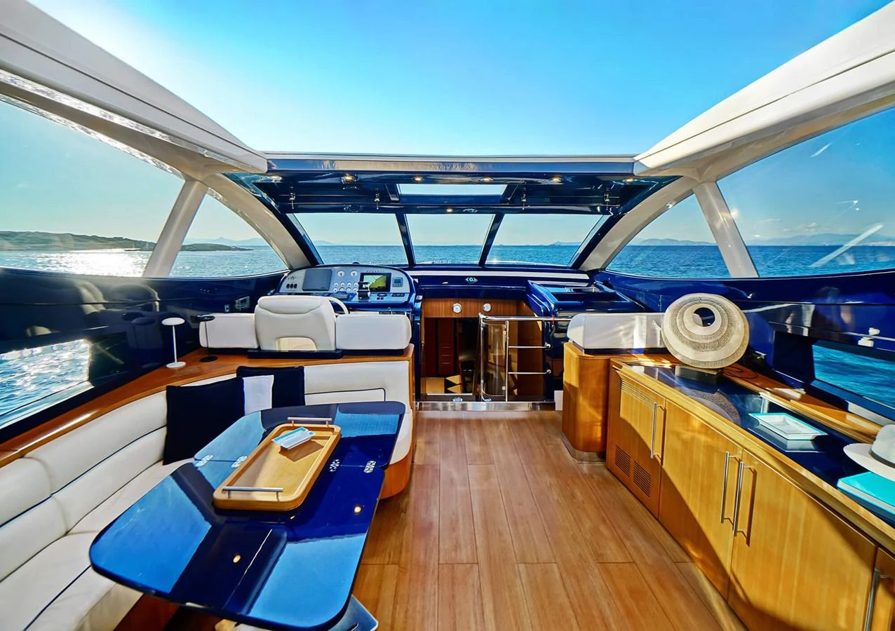 The yacht's salon offers a luxurious and spacious area with panoramic views of the sea. aboard RIVA 72' Yacht for Sale