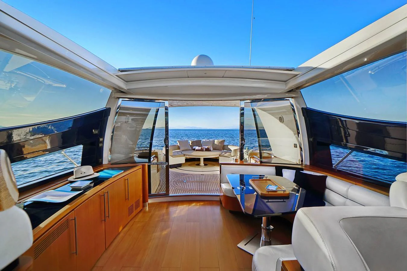 The salon offers a luxurious and open space with a stunning view of the sea. aboard RIVA 72' Yacht for Sale