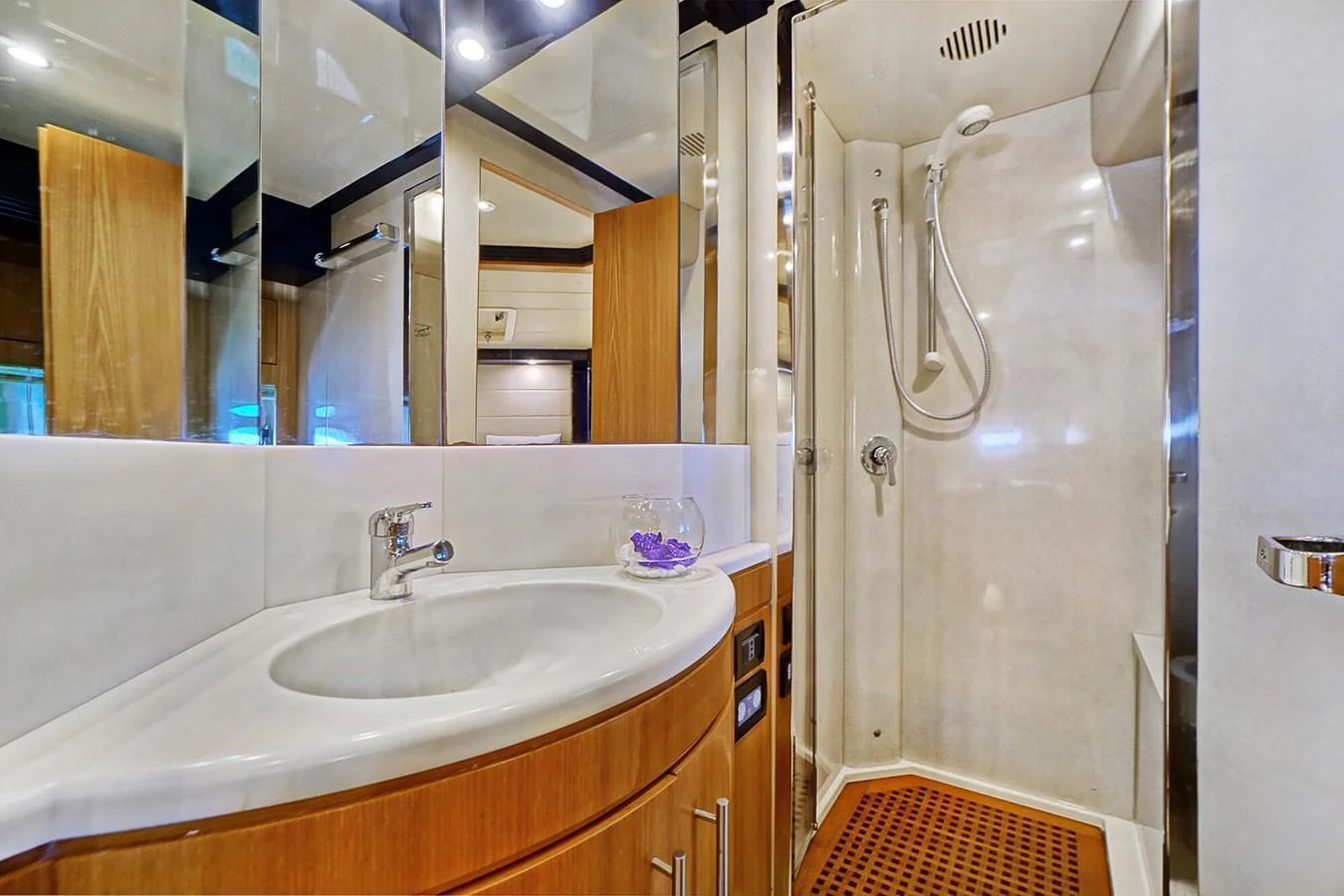 The yacht's bathroom features a sleek design with modern fixtures and a spacious shower. aboard RIVA 72' Yacht for Sale