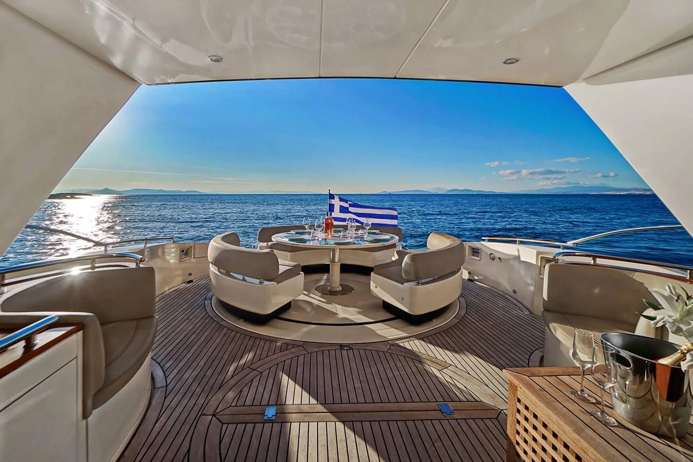 The aft deck offers a luxurious outdoor dining area with stunning sea views. aboard RIVA 72' Yacht for Sale