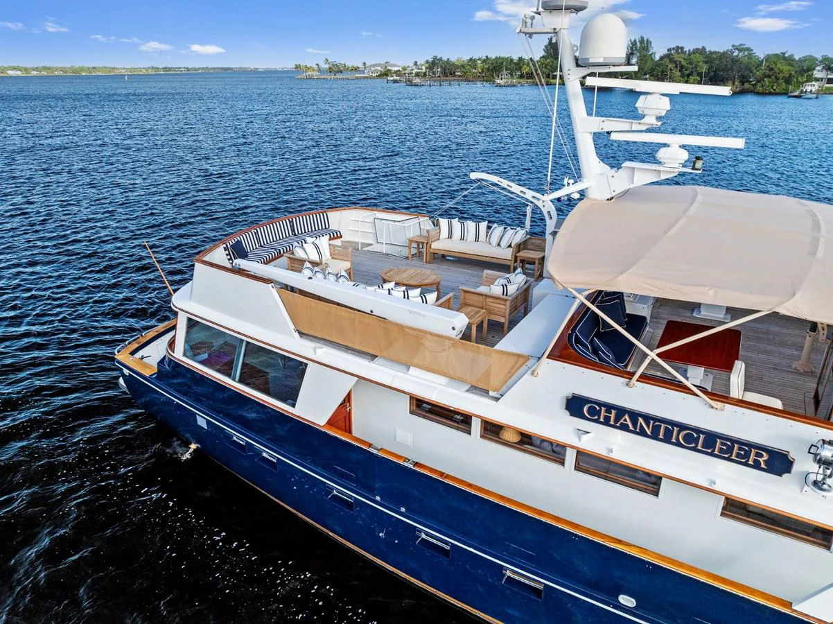 The yacht features a spacious aft deck with elegant seating and dining areas, perfect for enjoying the open water. aboard CHANTICLEER Yacht for Sale