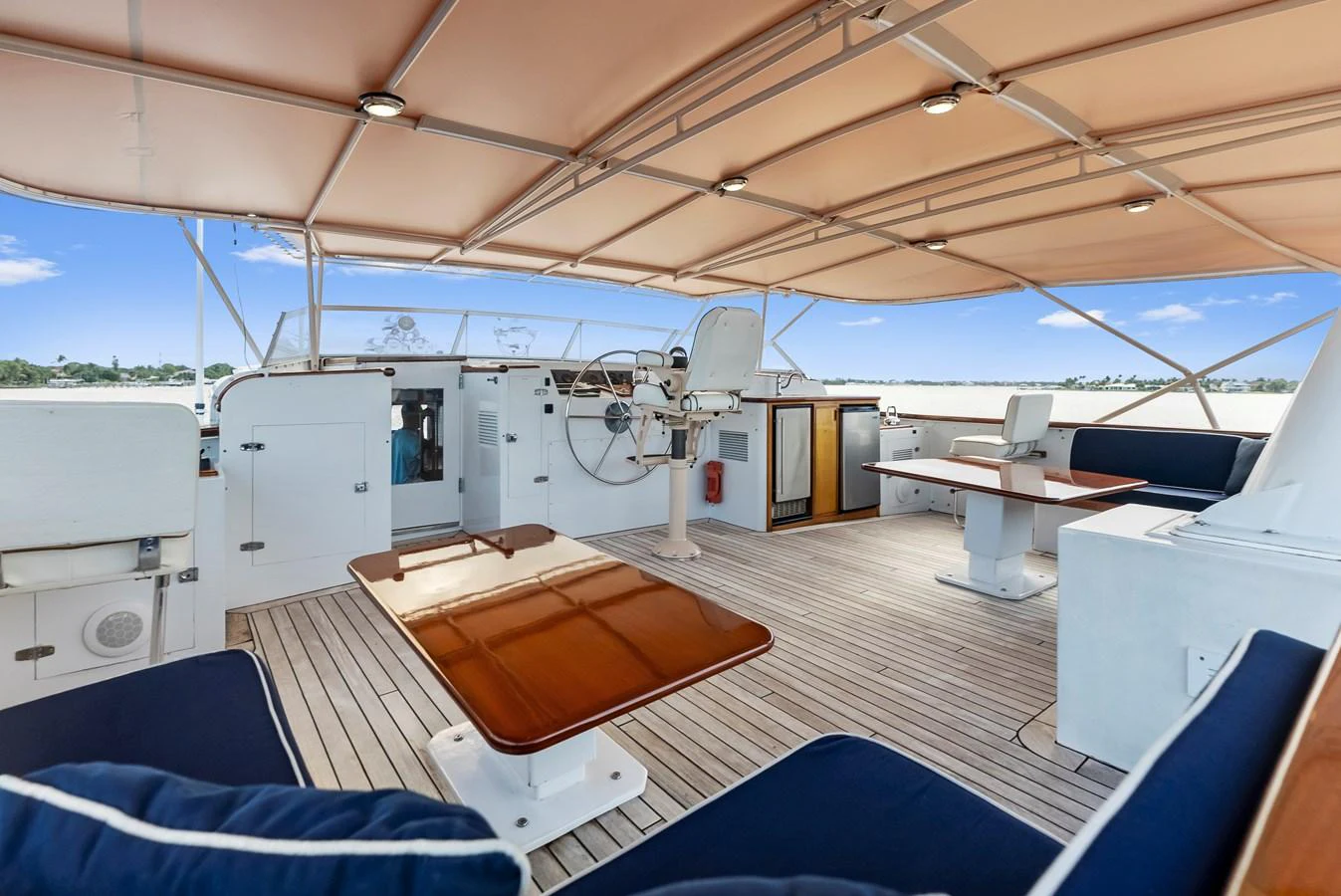 The flybridge offers a spacious and comfortable area for relaxation and navigation. aboard CHANTICLEER Yacht for Sale