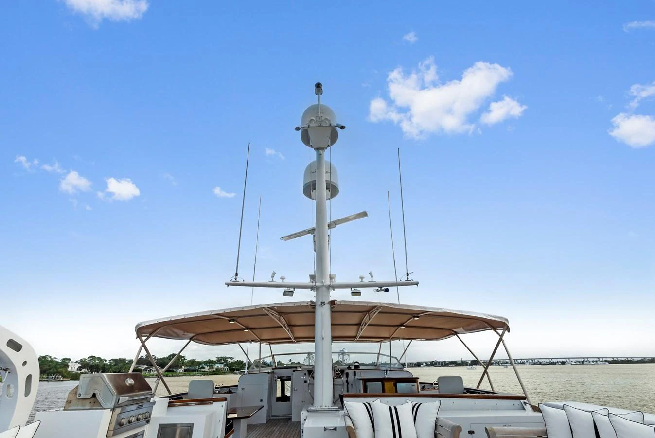 The flybridge offers a spacious and inviting area for relaxation and entertainment with a beautiful view of the water. aboard CHANTICLEER Yacht for Sale