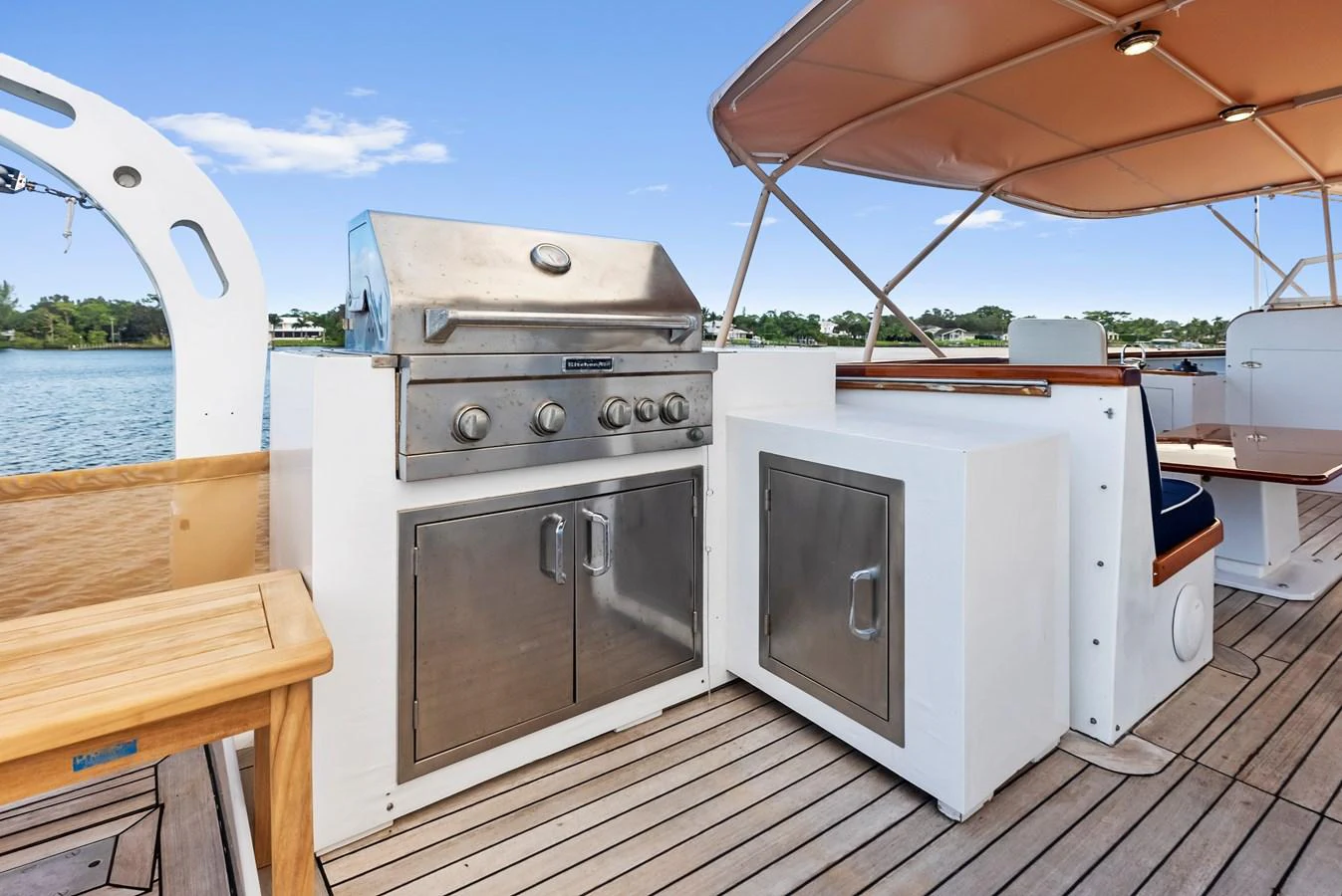 The yacht features an outdoor galley with a stainless steel grill and ample storage, perfect for alfresco dining. aboard CHANTICLEER Yacht for Sale