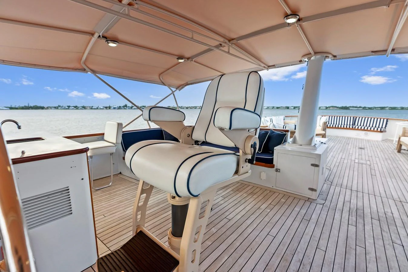 The flybridge offers a spacious and comfortable area with luxurious seating and a panoramic view. aboard CHANTICLEER Yacht for Sale