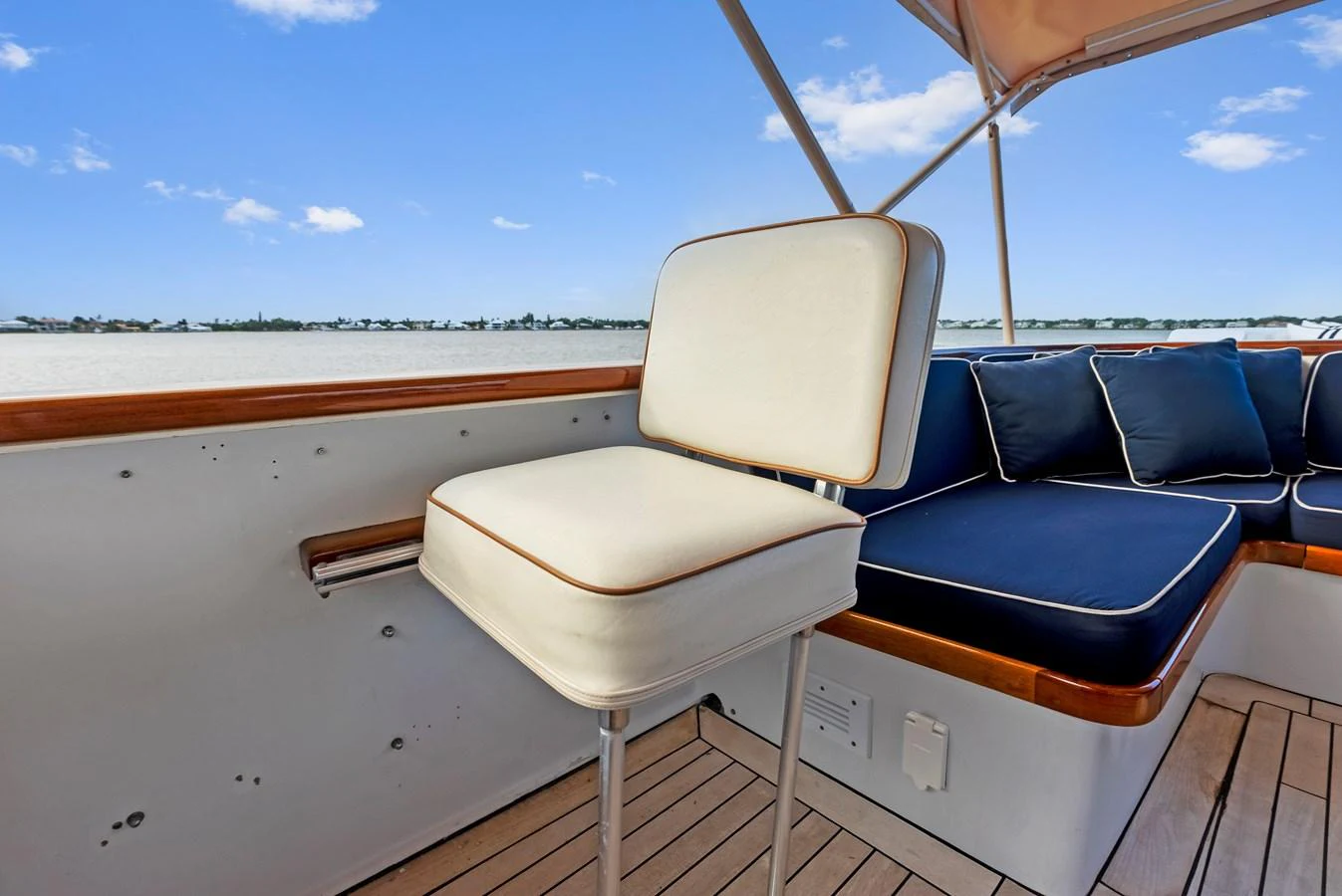 The flybridge features comfortable seating with a scenic view of the water. aboard CHANTICLEER Yacht for Sale