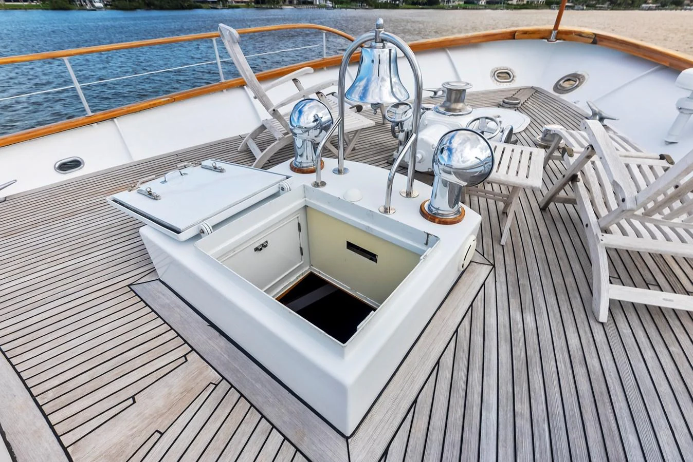 The image showcases a detailed view of the yacht's deck with a hatch and polished metal fittings. aboard CHANTICLEER Yacht for Sale
