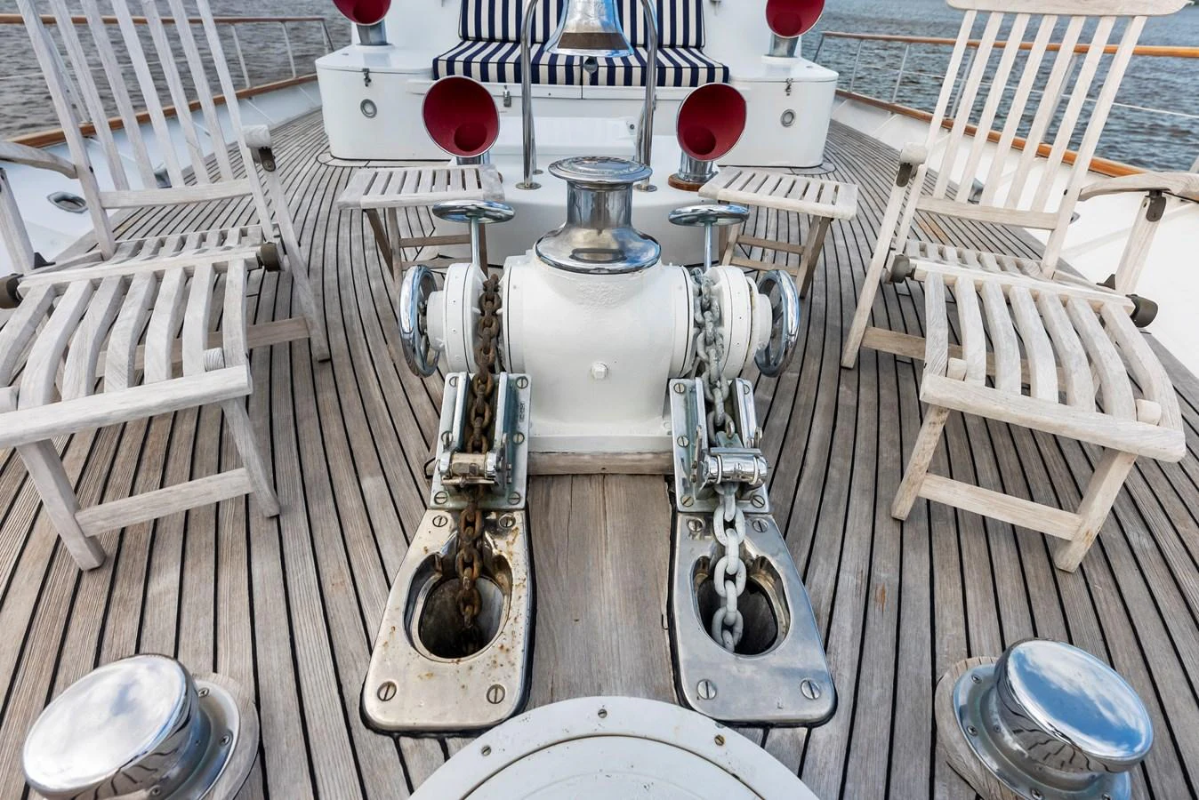 The foredeck features a well-maintained anchor windlass system with surrounding seating for relaxation. aboard CHANTICLEER Yacht for Sale