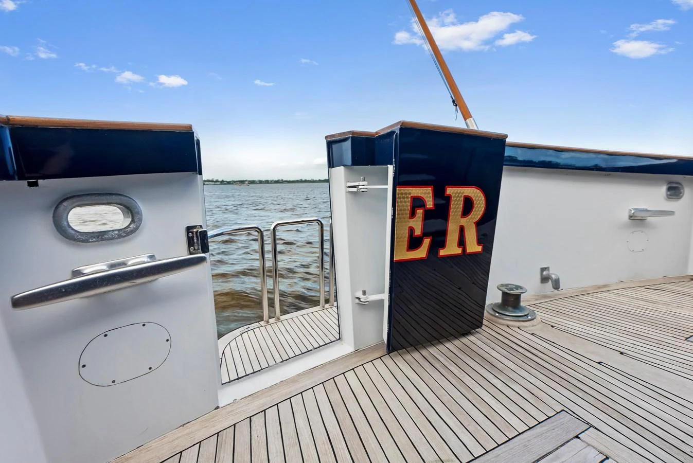 A detailed view of the yacht's deck with a focus on the entrance gate and decorative elements. aboard CHANTICLEER Yacht for Sale