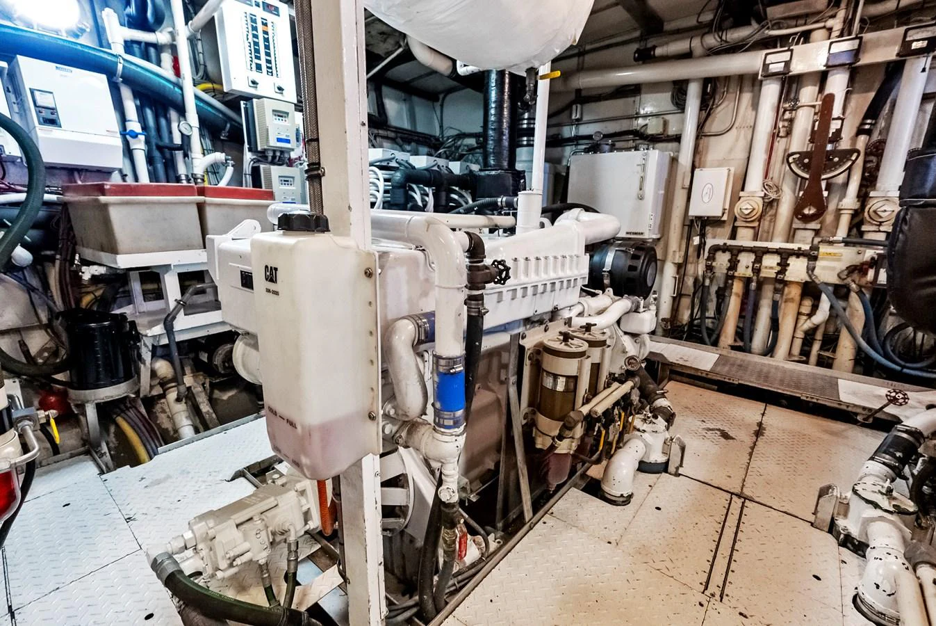The image showcases the well-maintained engine room of the yacht, highlighting its advanced machinery and equipment. aboard CHANTICLEER Yacht for Sale