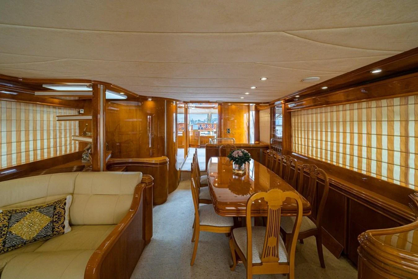 The yacht's dining area features elegant wooden furnishings and a spacious layout. aboard ASTONDOA 82 GLX Yacht for Sale