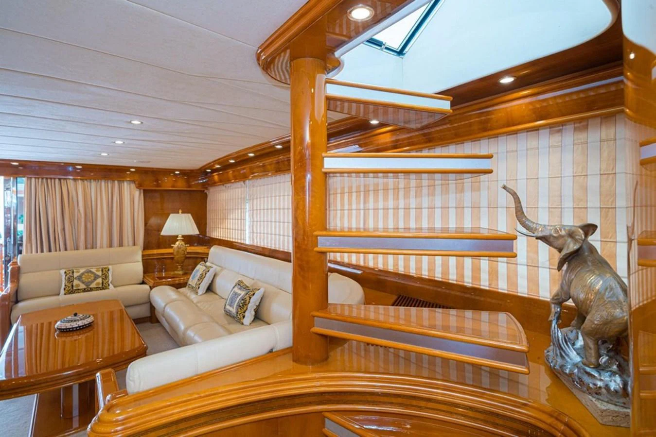 The yacht's salon features elegant woodwork, comfortable seating, and tasteful decor. aboard ASTONDOA 82 GLX Yacht for Sale