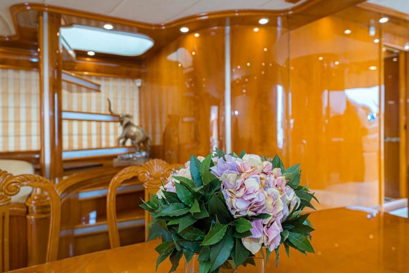 A luxurious interior space featuring polished wood finishes and elegant decor. aboard ASTONDOA 82 GLX Yacht for Sale