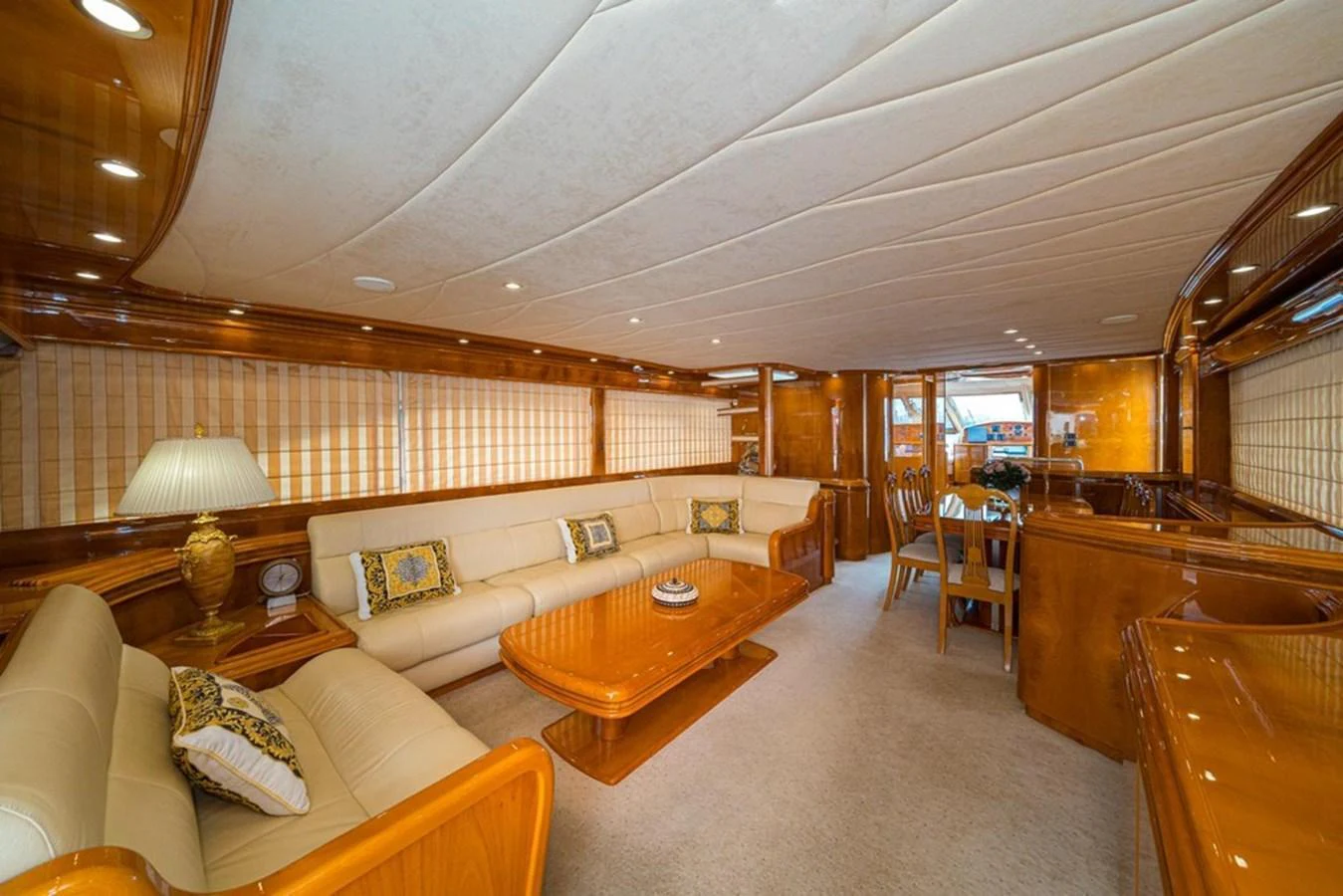 The yacht's salon features luxurious seating, elegant wood finishes, and ample natural light. aboard ASTONDOA 82 GLX Yacht for Sale