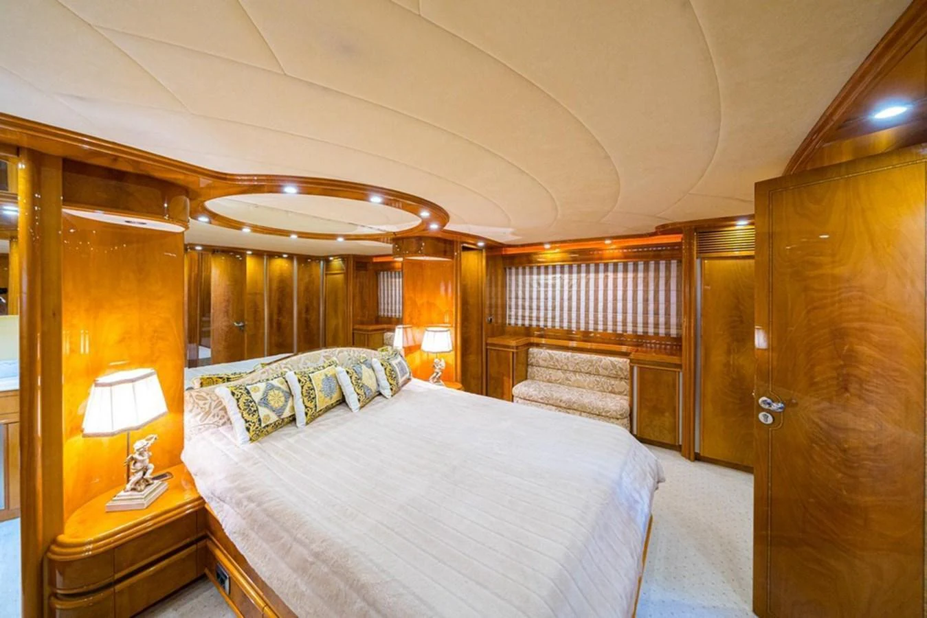 The master stateroom features luxurious wood paneling and elegant lighting. aboard ASTONDOA 82 GLX Yacht for Sale