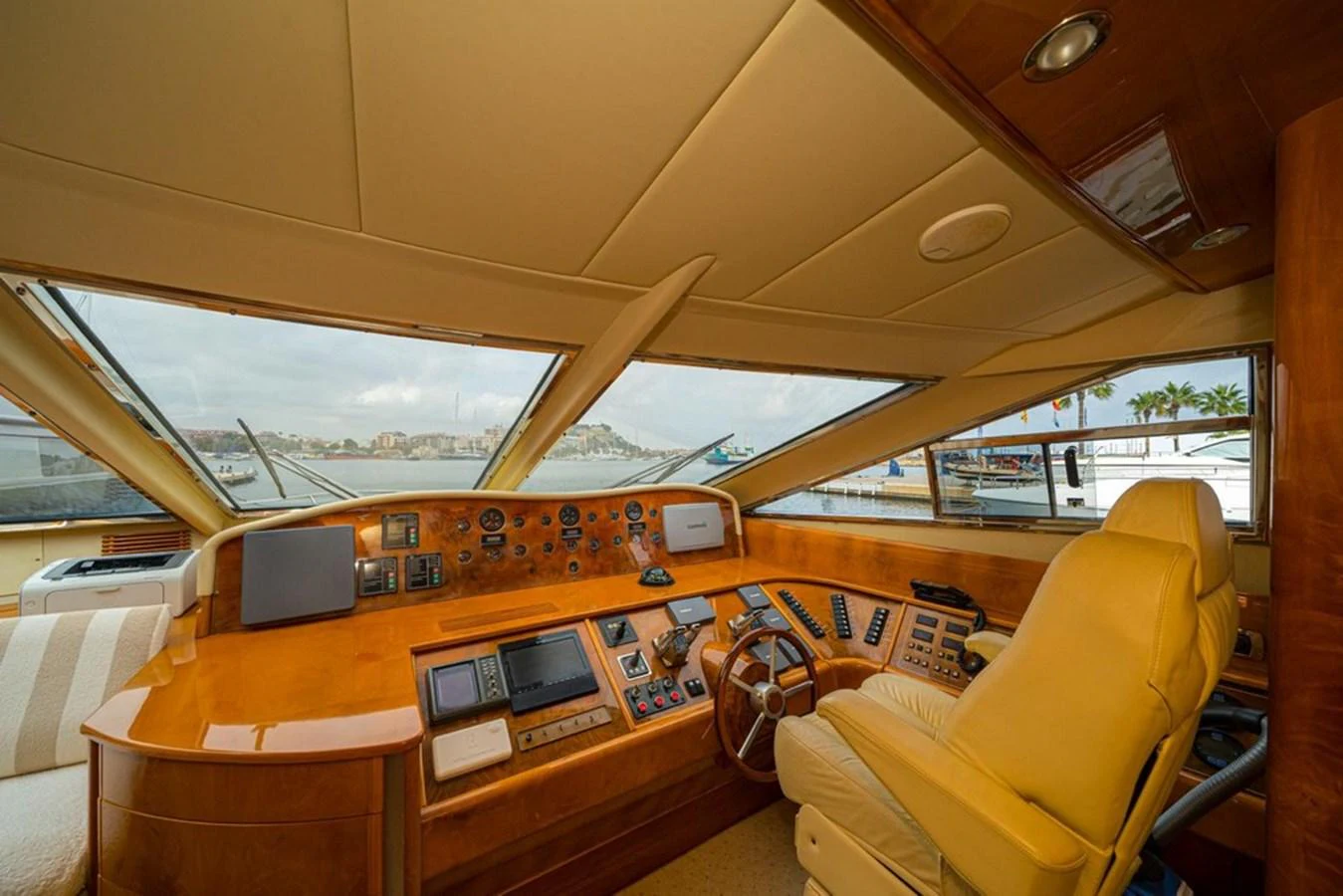 The helm station offers a commanding view with state-of-the-art navigation equipment and luxurious seating. aboard ASTONDOA 82 GLX Yacht for Sale