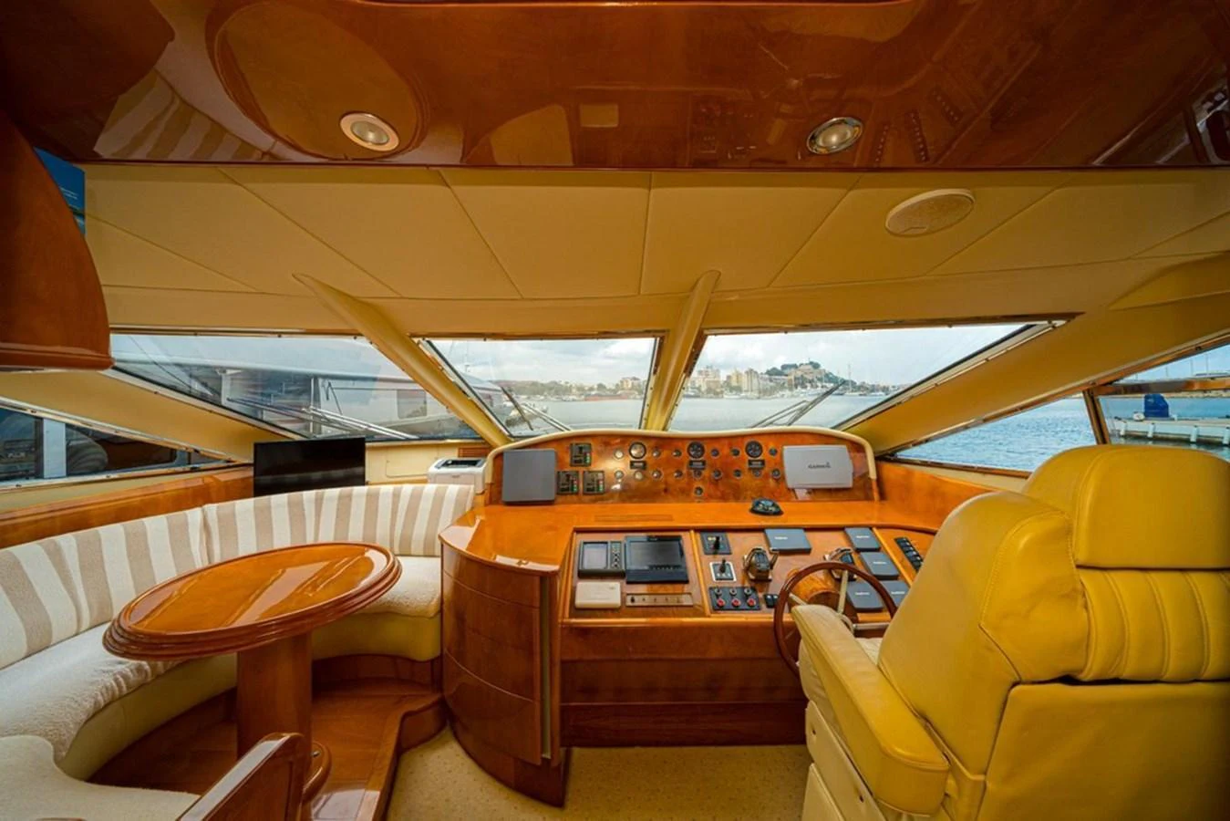 The helm of the yacht features luxurious seating and state-of-the-art navigation equipment with panoramic views. aboard ASTONDOA 82 GLX Yacht for Sale